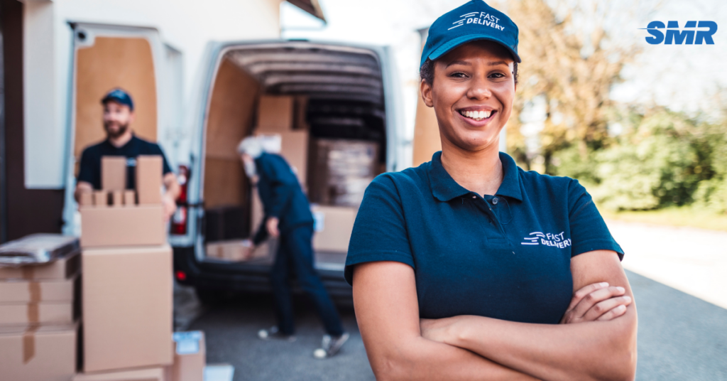 man and van Shoreditch E1 with branded removal van and mover loading boxes