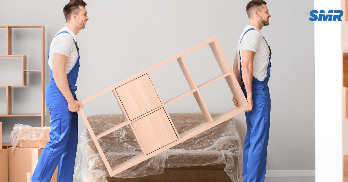Experienced movers carrying furniture during a house removal in Islington