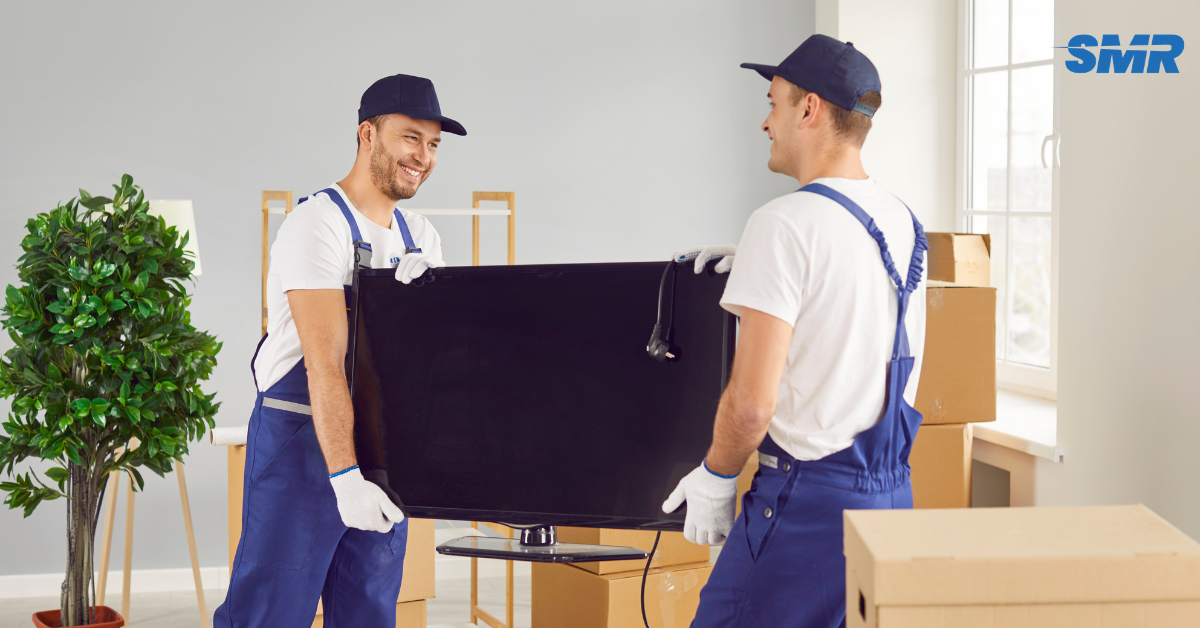 Experienced movers carrying furniture during a house removal in Islington