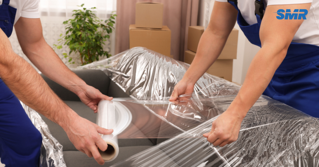 Man and van Notting Hill team carrying furniture for house flat and office removals