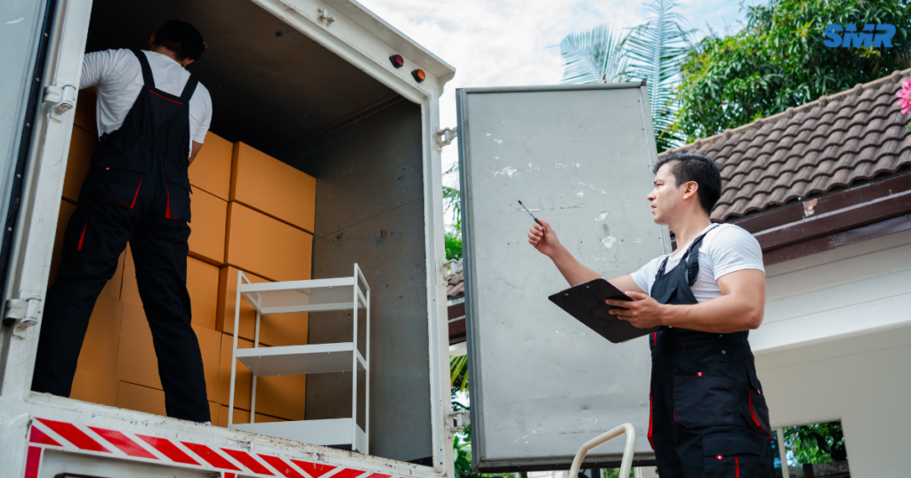Man and van Kilburn NW6 movers loading furniture into a removals van