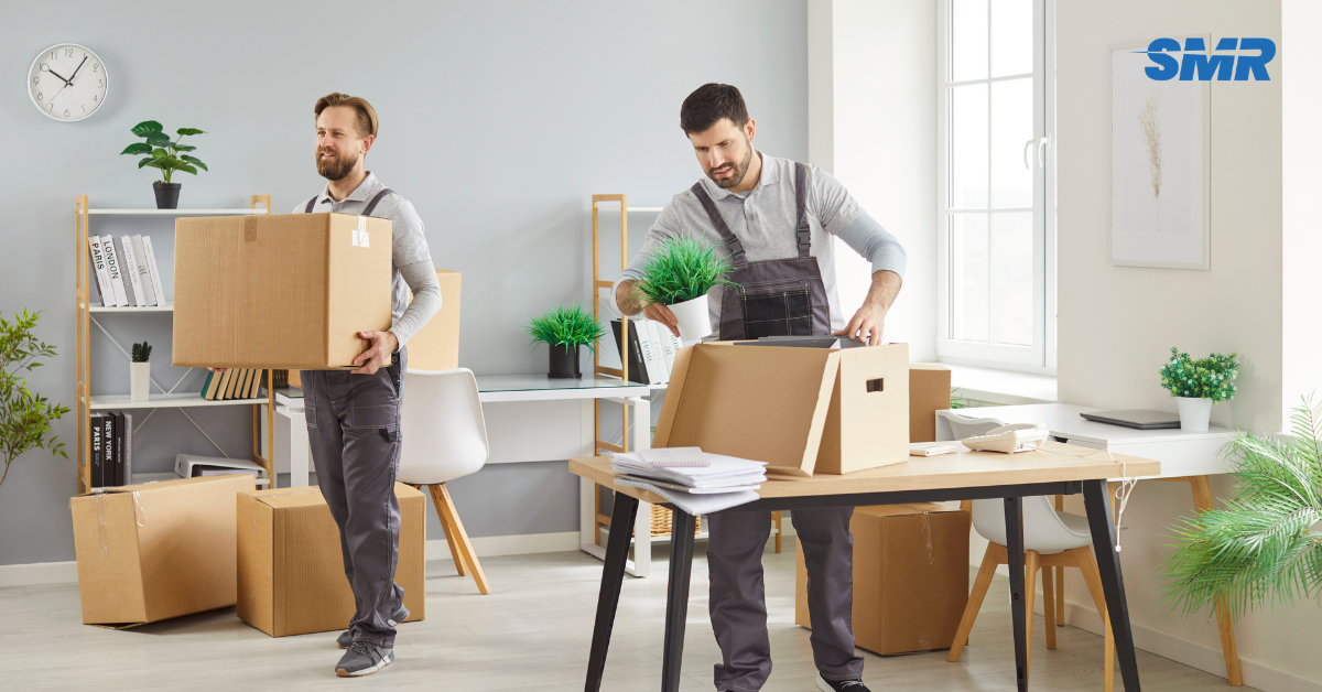 Professional man and van team loading furniture and boxes in East Ham Park E12