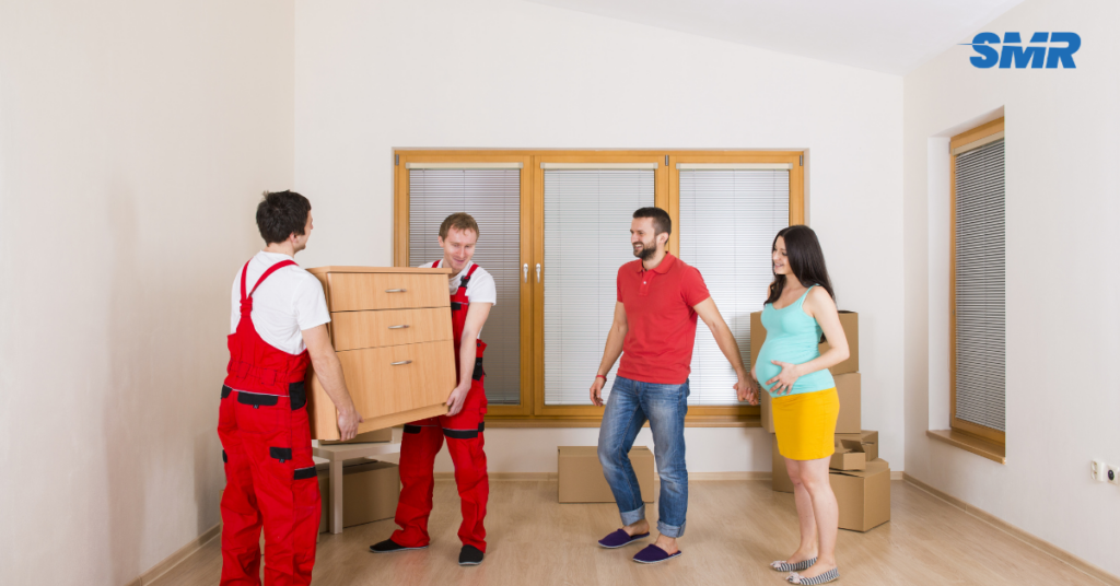 Flat removals SW13 London team moving boxes and furniture from an apartment