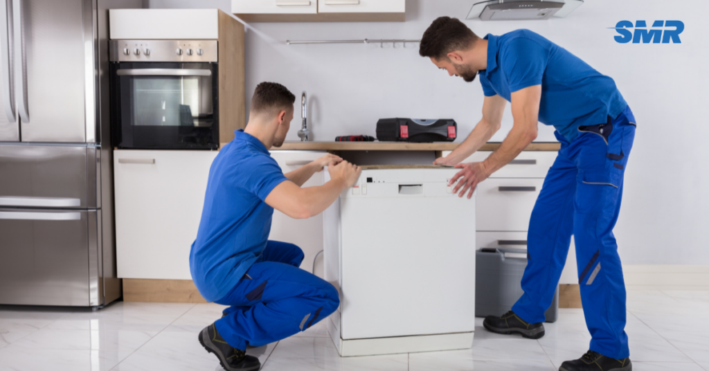 Movers carrying office equipment