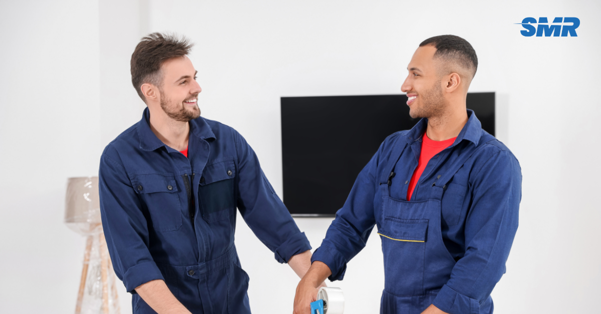Professional Man and Van SE26 London movers loading furniture and boxes outside a home