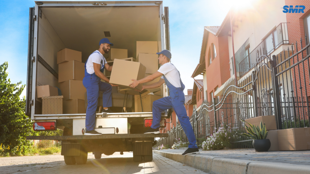 Movers carrying office equipment