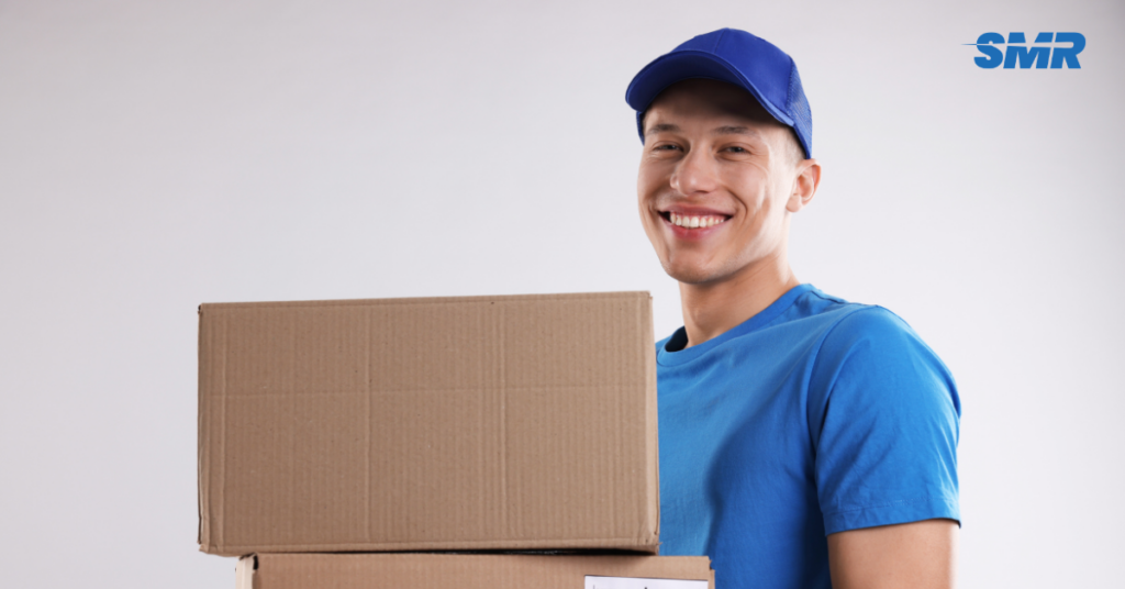 Man and Van SW17 London movers loading wrapped boxes into a removals van