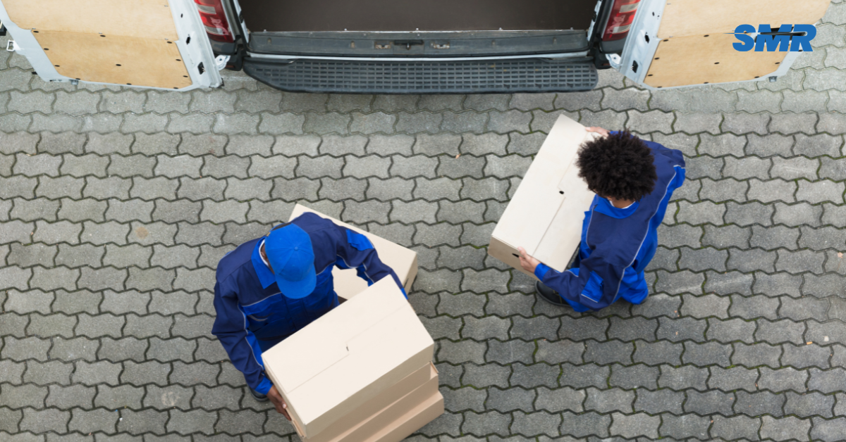 Professional Man and Van SE23 London movers loading boxes and furniture outside a home