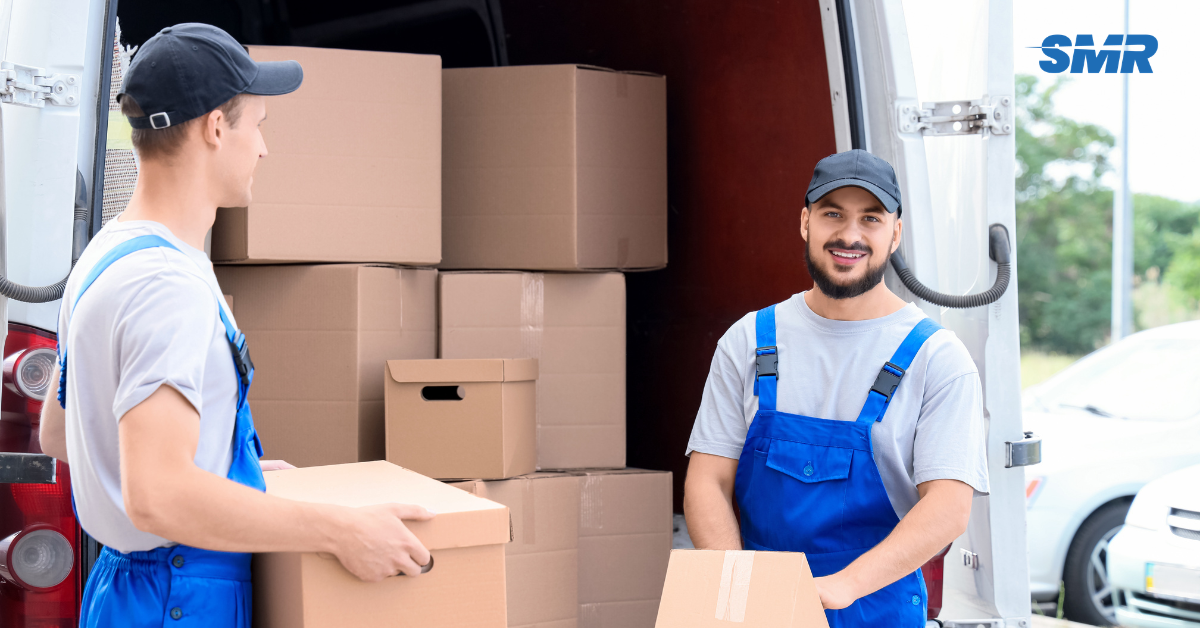Man and Van RM16 London house removals team loading moving boxes into a removals van