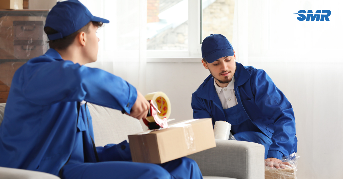 Man and Van SE2 London removals team moving wrapped boxes from a local home