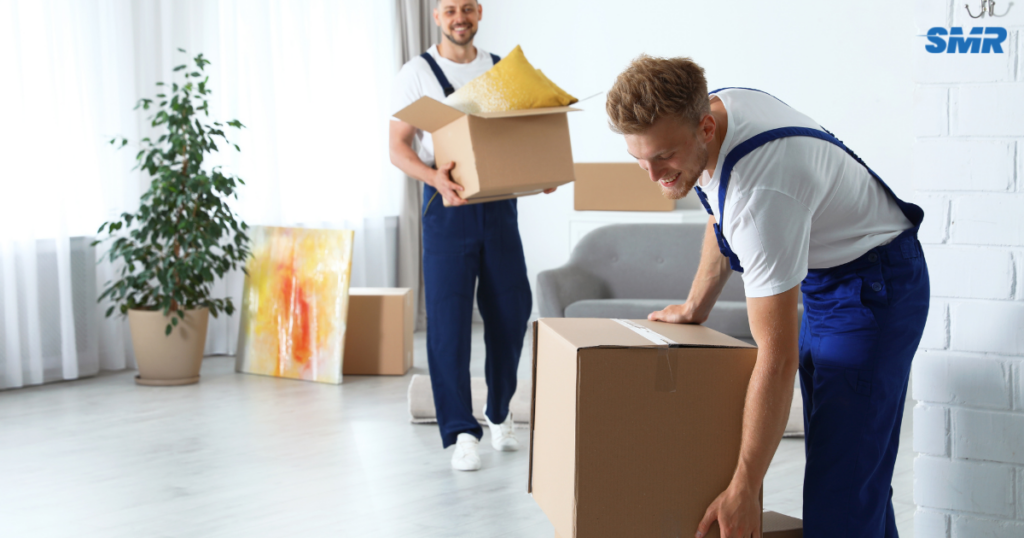 Man and Van Greenford movers loading furniture and moving boxes into a removals van