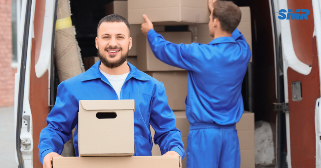 Movers handling furniture and boxes in SW3