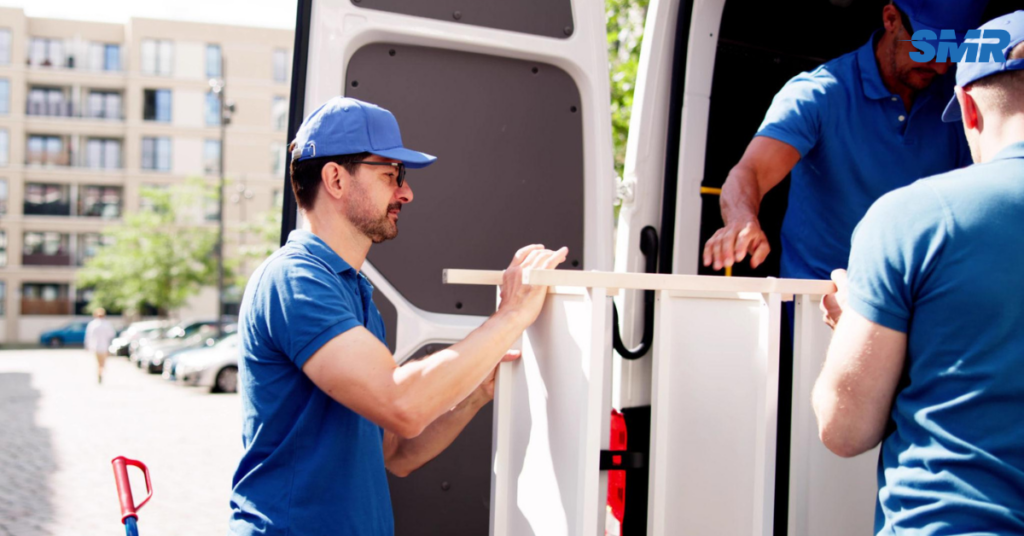 Cheap man and van Abbeywood removal service with movers loading boxes into a van